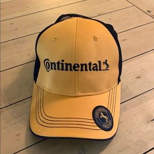 Like new continental orange and black trucker hat